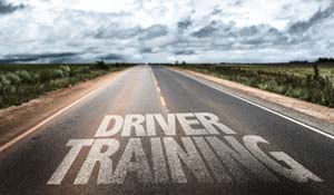 Driver training painted on road in yellow
